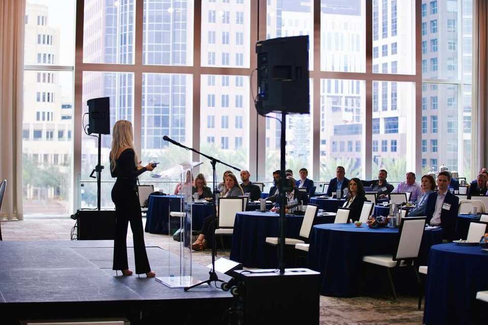 Molly speaking on stage